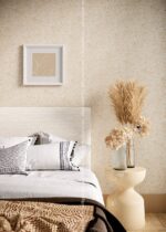 Silk Plaster Relief 322 on a bedroom wall behind an upholstered headboard and pampas grass