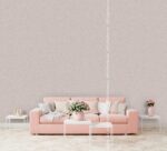 Silk Plaster Prestige 405 in warm greige above a pink sofa on a herringbone wood floor