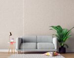 Silk Plaster Prestige 409 in warm taupe behind a light grey sofa and a large monstera