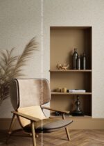 Silk Plaster Relief 325 in oatmeal beside a built-in wooden niche and a beige lounge chair