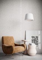 Silk Plaster Relief 330 in light grey with a tan velvet armchair and white pendant lamp