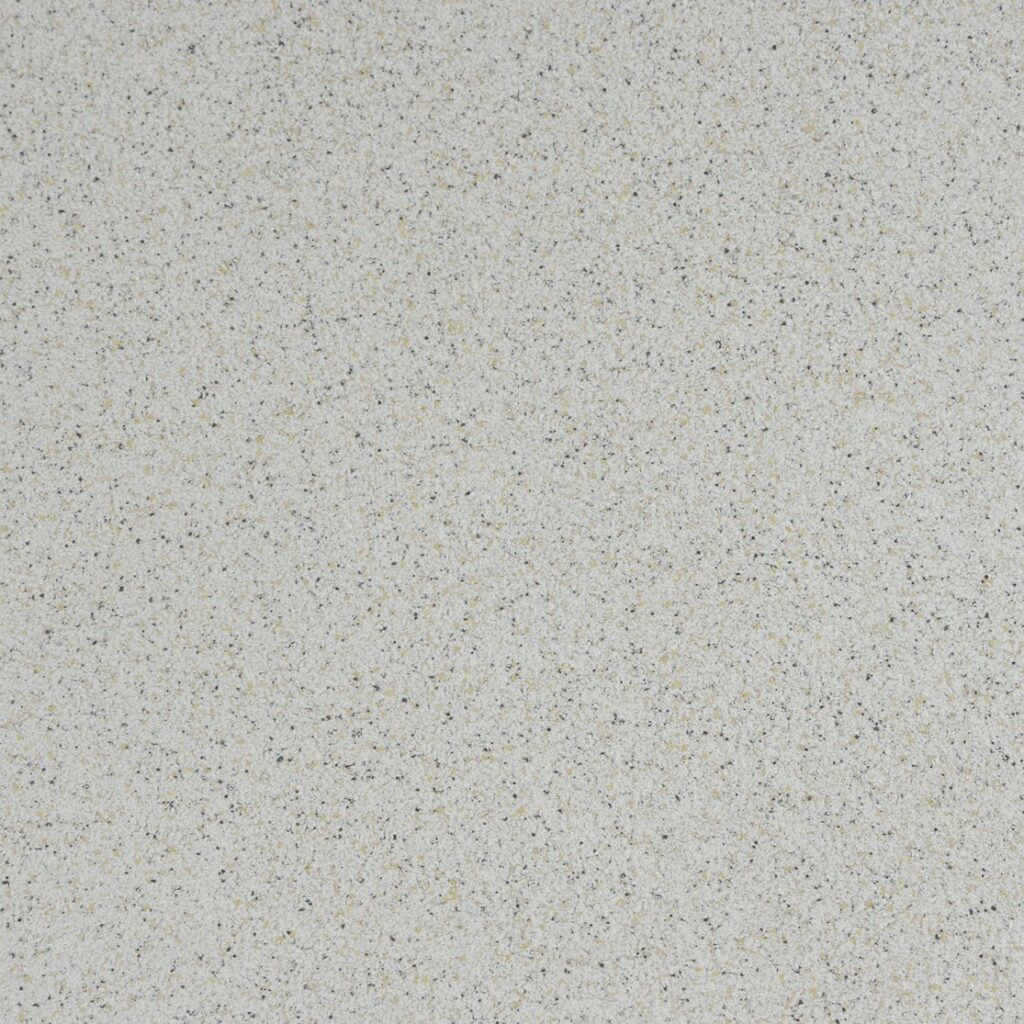 Close-up of Mixart elastic plaster in speckled cream with fine dark and ochre flecks
