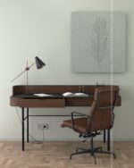 PrimeColor 5 tinted B3 sage green on a home office wall with a dark wood desk, brown leather chair and framed leaf textile art