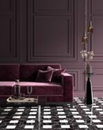 PrimeColor 5 tinted B21 deep plum panelled living room wall with a velvet sofa and amber pendant lights