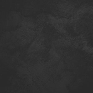 Close-up of Sabbia sand-effect paint texture in shade SA41, near-black charcoal