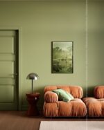 PrimeColor 5 tinted B36 olive green living room wall with a terracotta velvet sofa and a framed landscape print