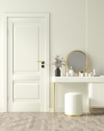 PrimeColor 5 tinted B2 pale cream on a wall beside a white panelled door and a gold-framed vanity mirror