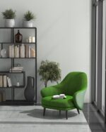 PrimeColor 5 tinted B5 light grey on a wall beside a black shelving unit and a green accent armchair