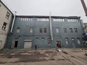 Brick facade coated with rubber paint