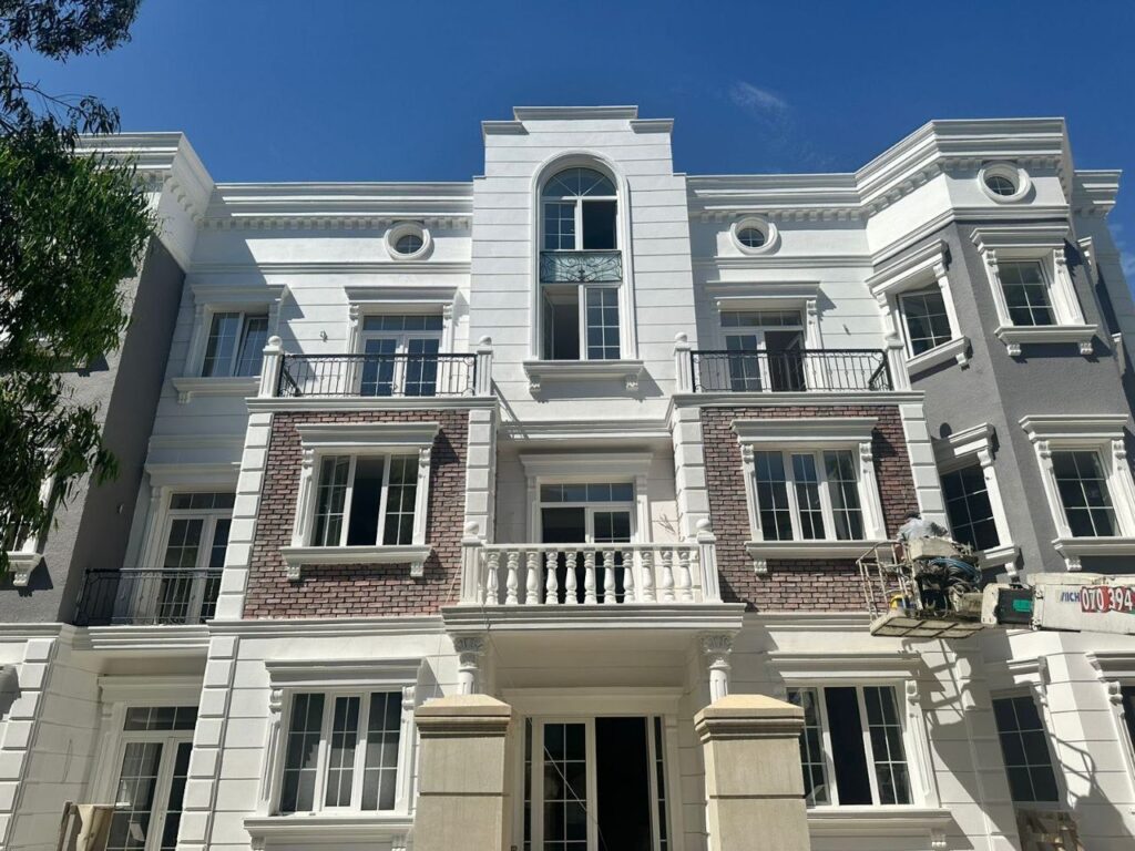 Brick facade coated with rubber paint