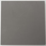 Marmorino Carrara sample tile in mid grey, matt lime plaster with a fine even texture
