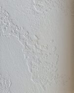 Travertino Naturale lime plaster wall finish with characteristic open-pore travertine texture — Silk Plaster